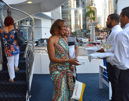 group of people talking on a yacht
